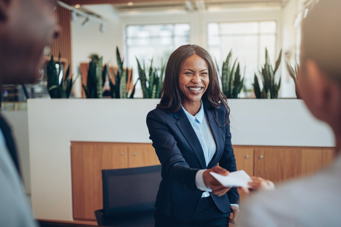 Portrait of Concierge Talking to Guests